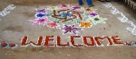 Welcome sign in chalk and flowers
